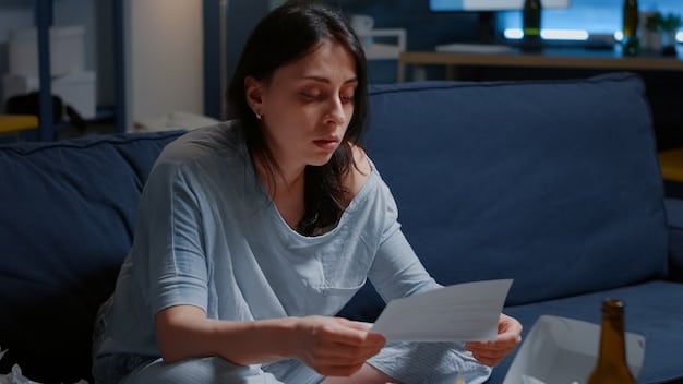 A worried person looking at an electricity bill, concerned about the high cost of energy usage.