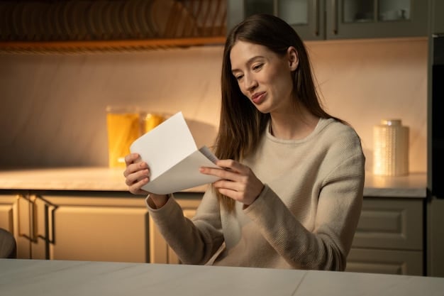 A person smiling and holding an electricity bill with a much lower amount than expected.