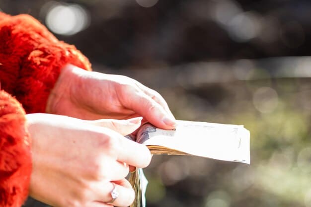 A close-up of a hand holding receipts and bills related to funeral expenses. The background is blurred, emphasizing the financial burden.
