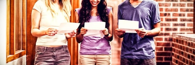 A person smiling and holding a large check, with a group of people celebrating in the background, symbolizing the successful acquisition of funding for a social project.