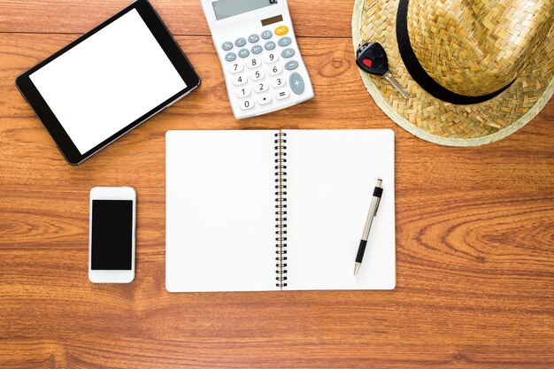 Overhead shot of a person reviewing financial documents with a calculator, cash bills, and spread sheets visibly on the desk, highlighting due diligence.
