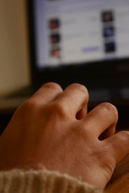 A person's hands typing on a laptop with a website showing an online petition platform, illustrating digital activism and community involvement.
