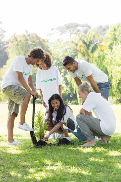 A group of Brazilian office workers planting trees in a deforested area, wearing company-branded t-shirts and smiling as they contribute to reforestation efforts.