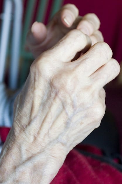 A close-up shot of the wrinkled hands of a retired woman gently holding the hand of a young child. Their eyes meet in a tender moment of connection, symbolizing the intergenerational mentorship possible through volunteering.