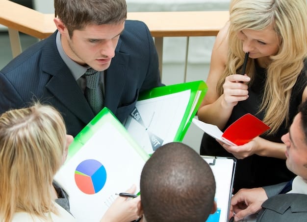 A leader facilitating a workshop for volunteers, showing charts and progress reports with a clear and enthusiastic demeanor.